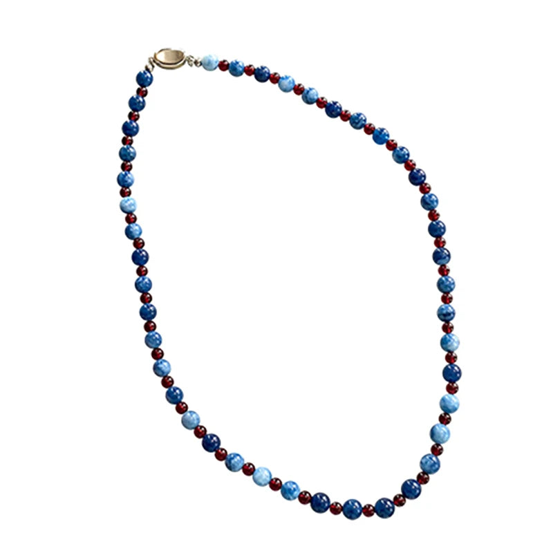 Necklace with blue and red beads on a white background